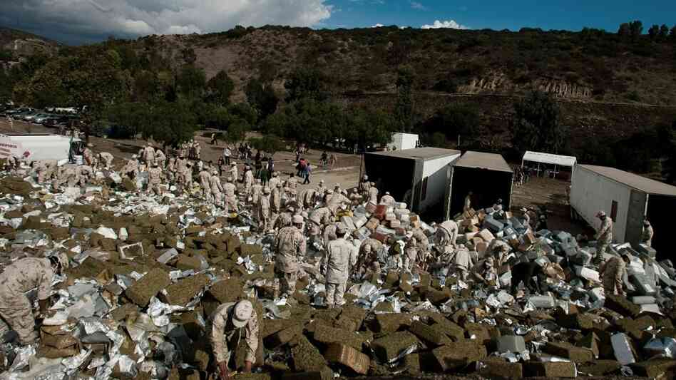 Members of the Mexican Army arrange 134 tons of marijuana