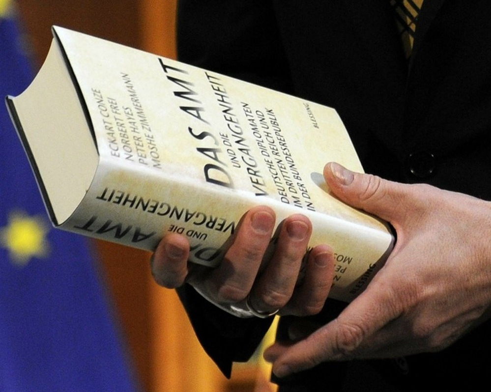 German foreign minister Guido Westerwell holds the book "Das Amt und die Vergangenheit".