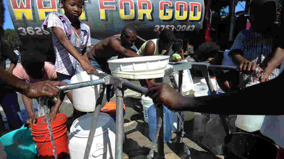 People distribute potable water People distribute potable water