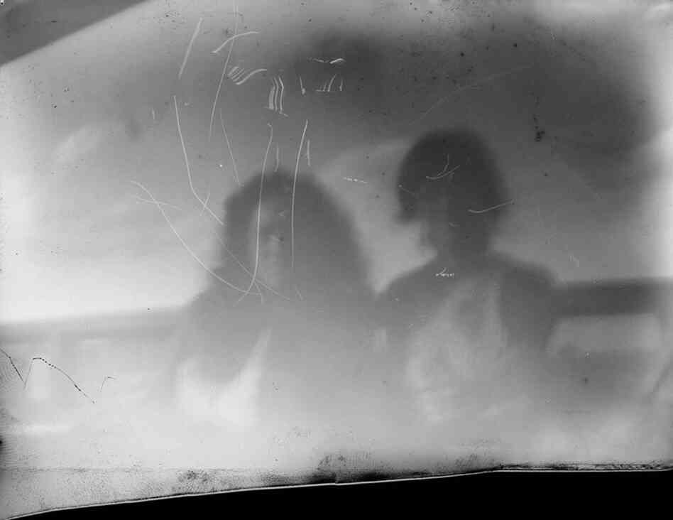 If you look closely, you can see our thumbs up. This was our longest exposure, at about 20 seconds. You can see clouds in the background, but unfortunately the rest of the image is too bright. Ghostly, you might say.