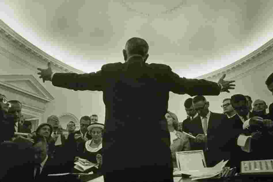 Lyndon B. Johnson's photographer Yoichi Okamoto disappeared behind the President to make this image. 