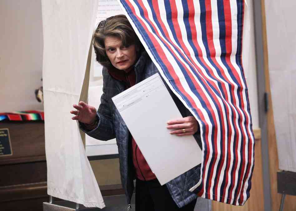 Sen. Lisa Murkowski emerges from a voting booth after filling out her ballot in Girdwood, Alaska. Murkowski is defending her Senate seat as a write-in candidate. If she wins, she would be the first successful write-in candidate for Senate since South Carolina's Strom Thurmond in 1954. 