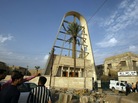 Iraqis outside the Sayidat al-Nejat Catholic Cathedral in Baghdad, the morning after gunman attacked Iraqis outside the Sayidat al-Nejat Catholic Cathedral in Baghdad, the morning after gunman attacked