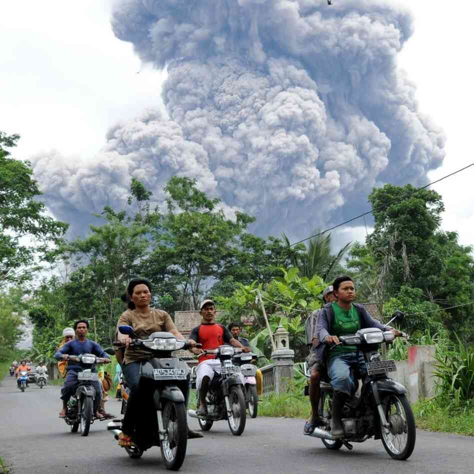 Residents flee danger as Merapi erupts again. Residents flee danger as Merapi erupts again.
