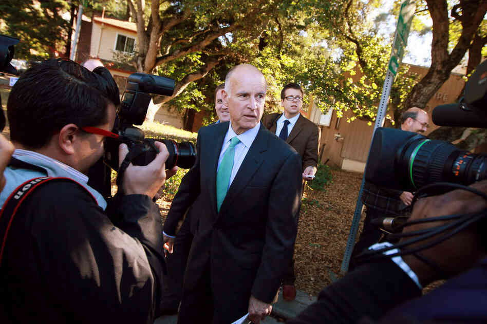 Jerry Brown, California's attorney general, talks to reporters after voting in Oakland. Brown won a bitter race against his Republican gubernatorial challenger, former eBay CEO Meg Whitman. 