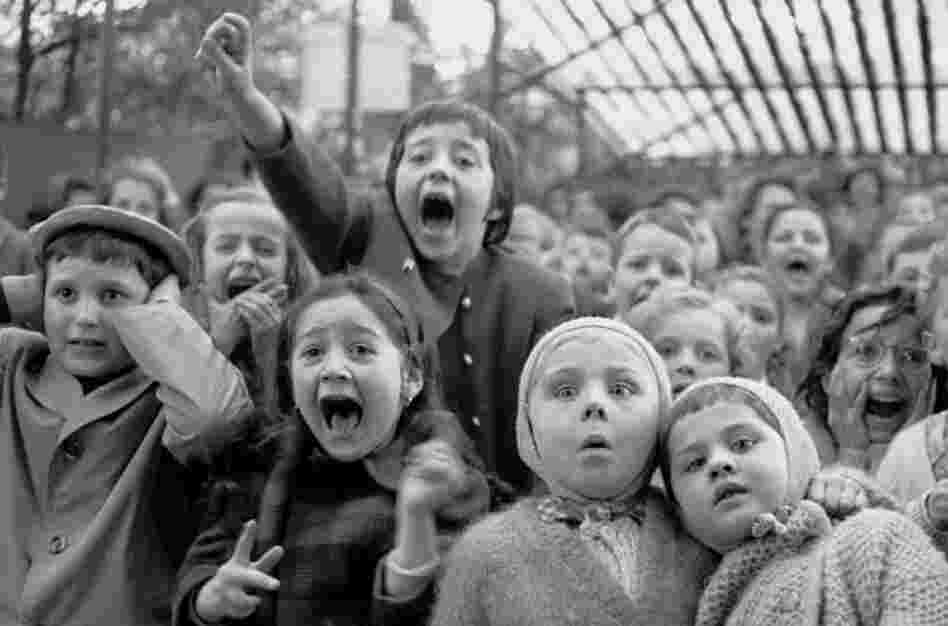As a significant event and a famous picture, you might expect to see here Alfred Eisenstaedt's sailor kissing a nurse in Times Square. Of course it is in the book, but unseen in that photograph is the quality that guided Eisie's photography: anticipation. And so it was at a puppet show in Paris; he anticipated the slaying of the dragon and captured the young audience's surprise and delight. Pup...