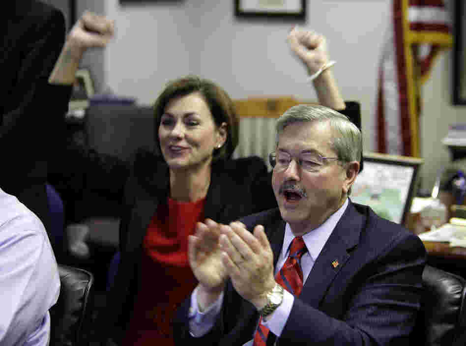 Iowa Republican gubernatorial candidate Terry Branstad and his running mate Kim Reynolds react to victorious election returns. 