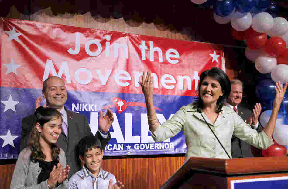 Surrounded by her family, South Carolina Gov.-elect Nikki Haley (right) gives her acceptance speech. 