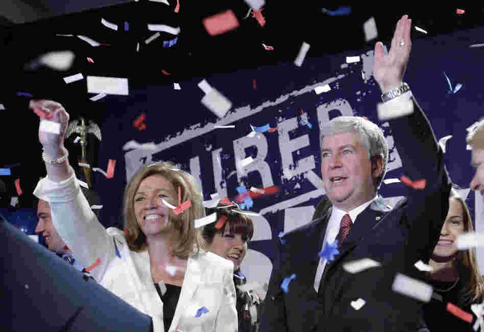 Michigan Gov.-elect Rick Snyder (right) and Michigan Supreme Court justice-elect Mary Beth Kelly wave at GOP supporters in Detroit. 