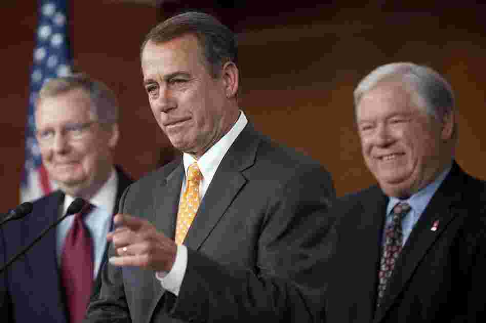 House Republican Leader John Boehner, R-OH (center), speaks during a press conference with Senate Republican Leader Mitch McConnell (left) and Mississippi Governor Haley Barbour (right) on Capitol Hill. 