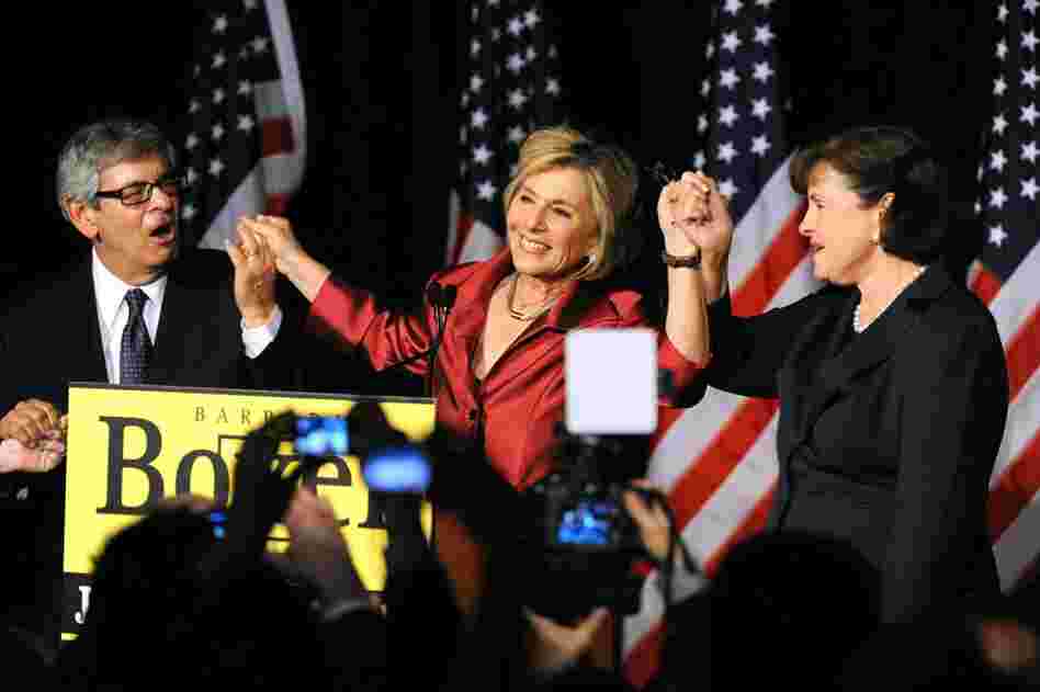 Sen. Barbara Boxer, D-CA, (center) celebrates with her husband and Sen. Dianne Feinstein after winning a fourth term in a close race against Republican candidate Carly Fiorina. 