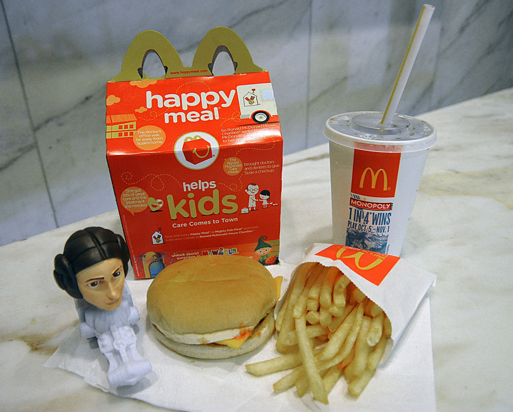 A McDonald's Happy Meal with a Star Wars figure.