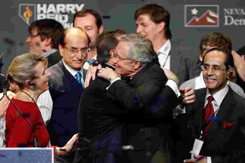 Senate Majority Leader Harry Reid embraces family members after defeating Sharron Angle in Nevada. Reid's victory helped Democrats hold their Senate majority. 