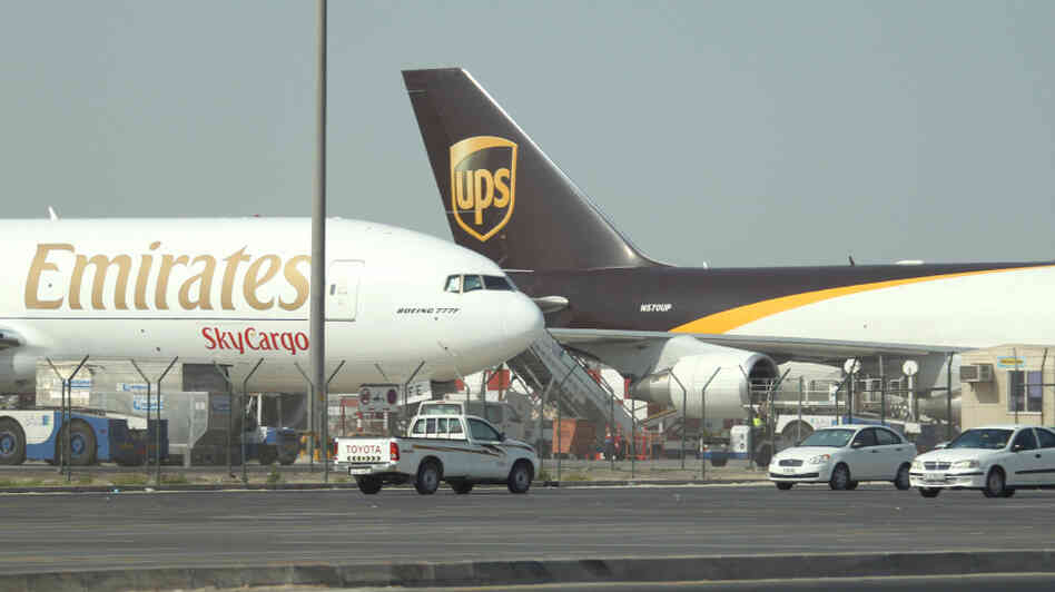 Emirates and UPS cargo planes sit on the Emirates and UPS cargo planes sit on the