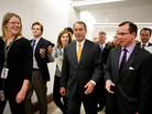 Republican Leader John Boehner is surrounde by reporters.