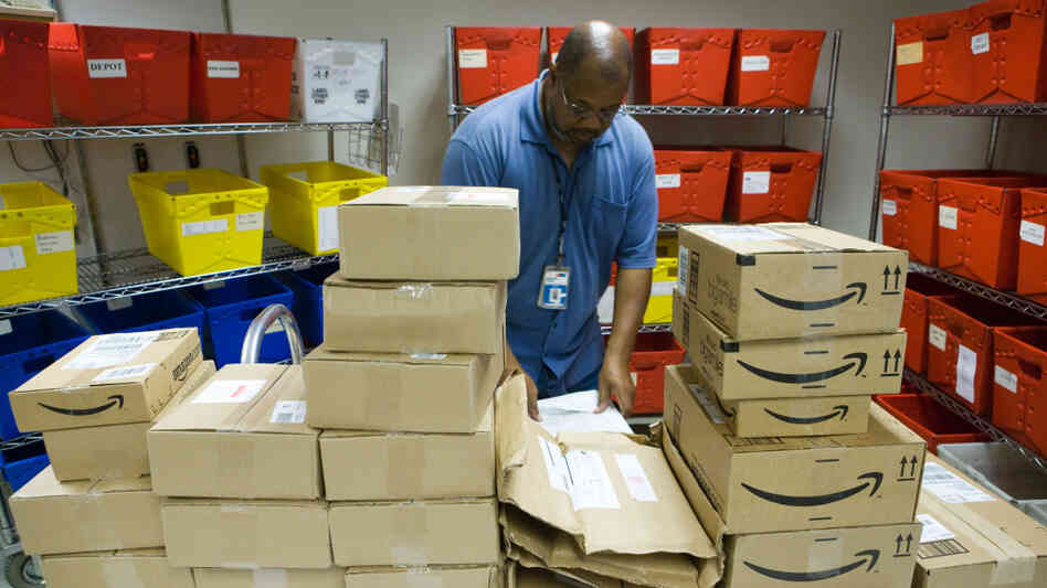 Nathaniel Horton sorts through books in NPR's mailroom. Nathaniel Horton sorts through books in NPR's mailroom.