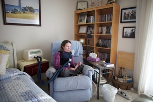 On the wall of her apartment are pictures of Beckett as a child with President Reagan. Reagan created the "Katie Beckett waiver" that changed the Medicaid rules to allow severely disabled children and adults to get government-funded care in their own homes.