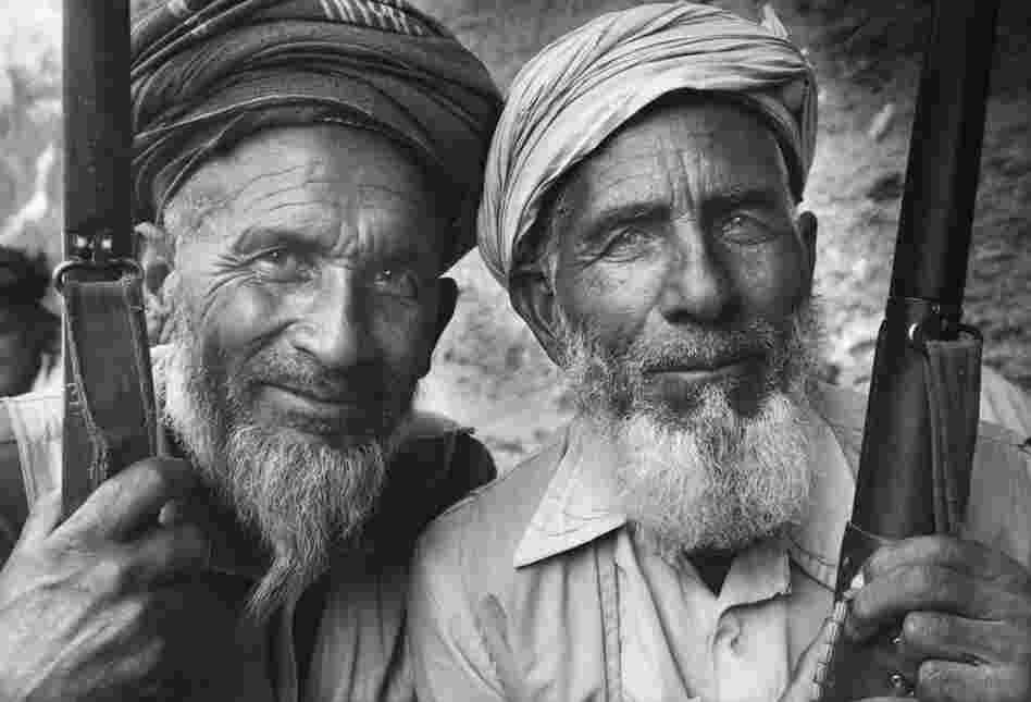Two Mojahedin fighters, Afghanistan, circa 1990. By the end of the 80s, Gobachev withdrew Russia from Afghanistan, and extreme Taliban fighters had taken tighter control of Afghanistan law. 
