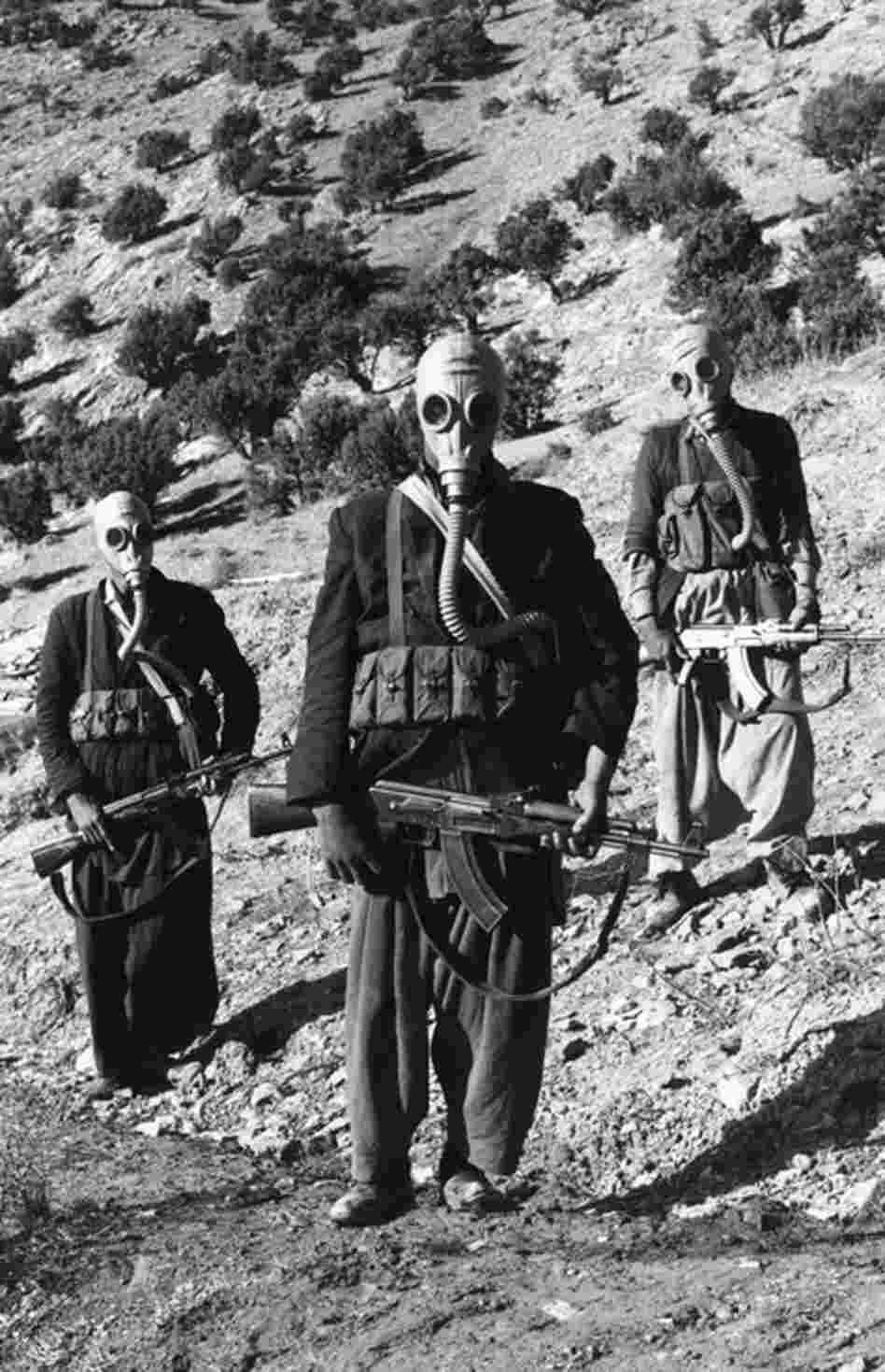 Members of the Mojahedin, rebel Muslim tribe, wearing Russian breathing apparatus for use in chemical warfare, Afghanistan, 1981. Russia claimed that it had been invited by the government for support. 