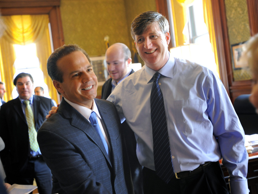 <strong>A Milestone:</strong> Retiring Rhode Island Rep. Patrick Kennedy (right) puts his arm around his successor, Providence Mayor David Cicilline, in Providence on Sunday. When Kennedy leaves office, it will be the first time in 60 years that a Kennedy will not hold elected office in the nation's capital.