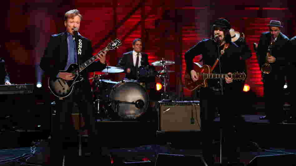 Conan O'Brien plays guitar with Jack White Conan O'Brien plays guitar with Jack White