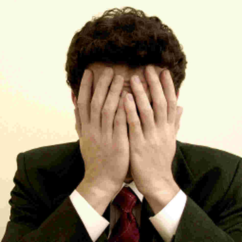 a man with his hands over his eyes a man with his hands over his eyes