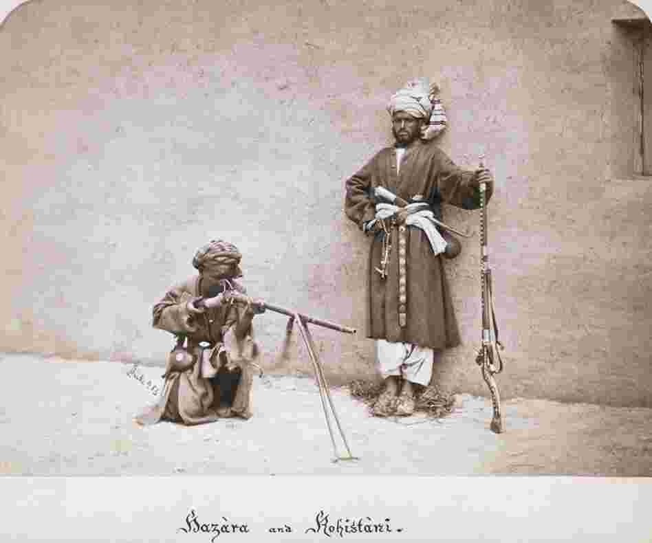 Two armed Afghan tribesmen in traditional clothing during the Second Afghan War, circa 1880. 