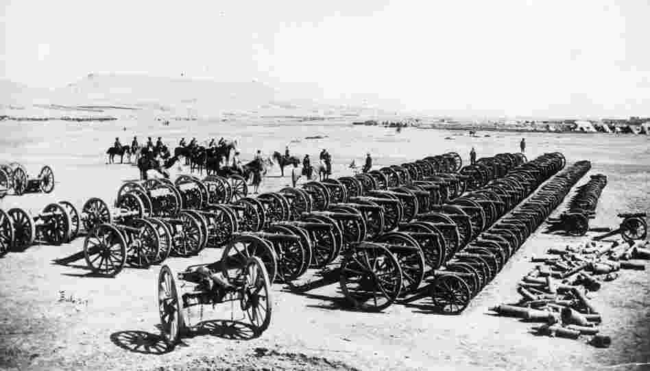 A British military commander and his men, inspecting captured guns after the defeat of Ayub Khan at Kandahar, which put an end to the Second Afghan War. 
