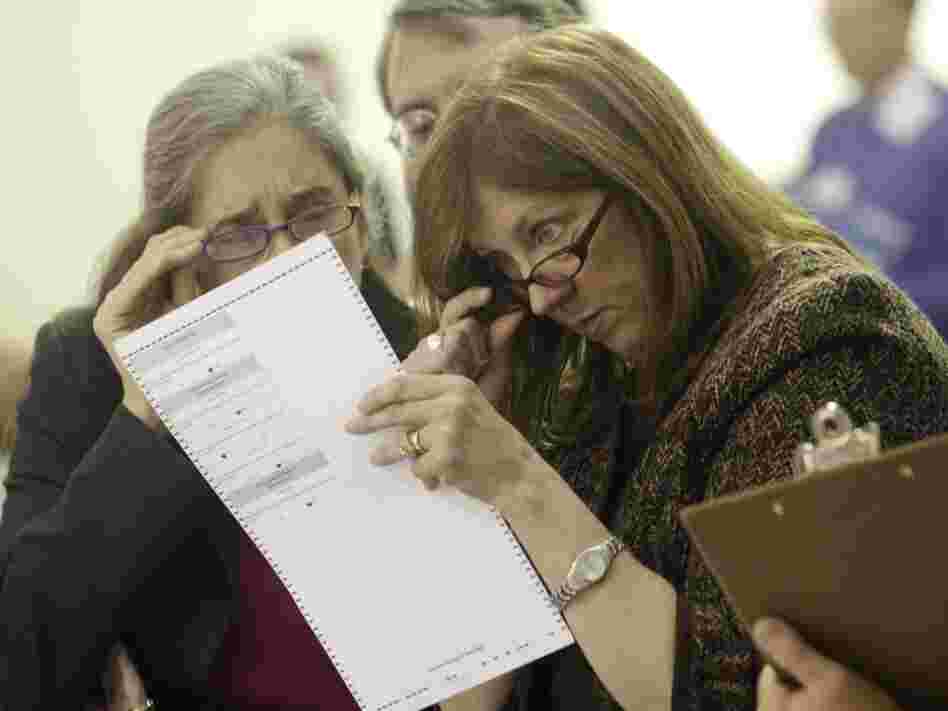 Alaska election officials inspect ballot Alaska election officials inspect ballot