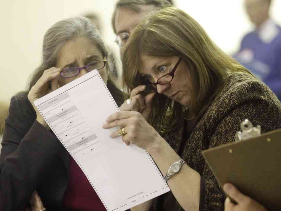Alaska election officials inspect ballot Alaska election officials inspect ballot