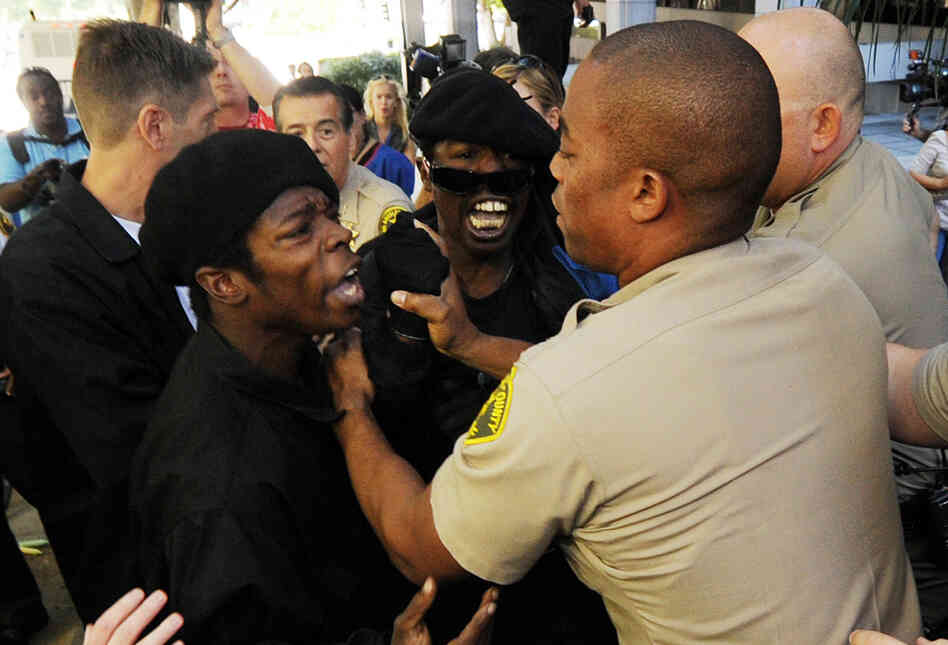 Sheriff's deputies scuffle with members of the Black Riders Liberation Front Sheriff's deputies scuffle with members of the Black Riders Liberation Front