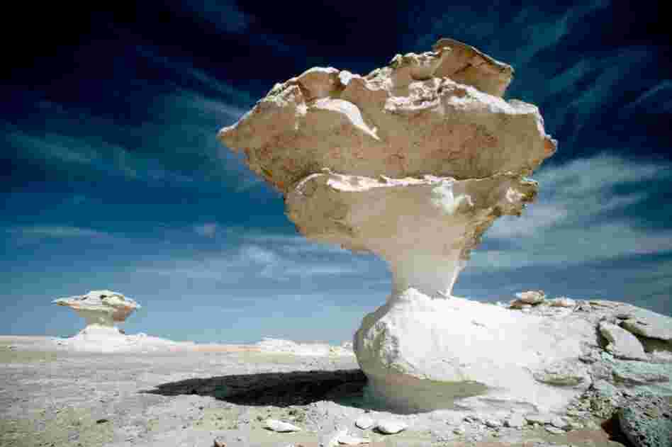 In the middle of Egypt's White Desert, by the Al-Farafrah Oasis, stand massive chalk rock structures created by sandstorms.Credit: O. Alamany & E. Vicens/Corbis