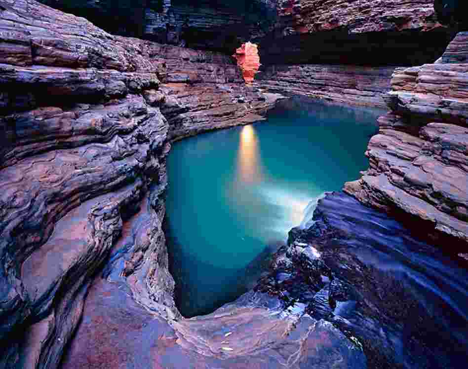 Some 2.5 billion years ago sediments accumulated on an iron-rich sea floor, forming these rocks exposed at gorges in the Karijini National Park of Western Australia.  Credit: Richard van Hoesel