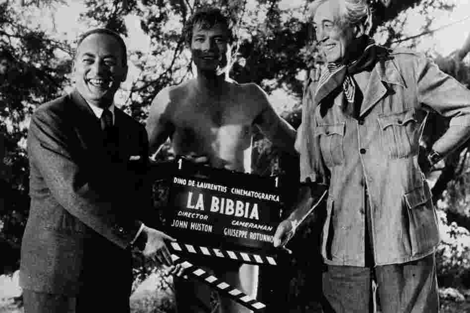 De Laurentiis (from left), actor Michael Parks and director John Huston prepare to shoot the Garden of Eden scene for the epic La Bibbia (The Bible: In the Beginning) in Italy.  