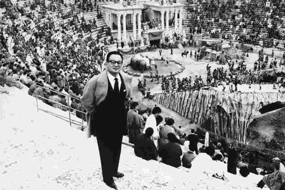 De Laurentiis turns his back on a scene being filmed for his biblical movie Barabbas at his studio near Rome, Aug. 30, 1961. 
