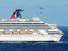 A Navy helicopter delivers pallets of supplies to the Carnival cruise ship Splendor off the coast of A Navy helicopter delivers pallets of supplies to the Carnival cruise ship Splendor off the coast of