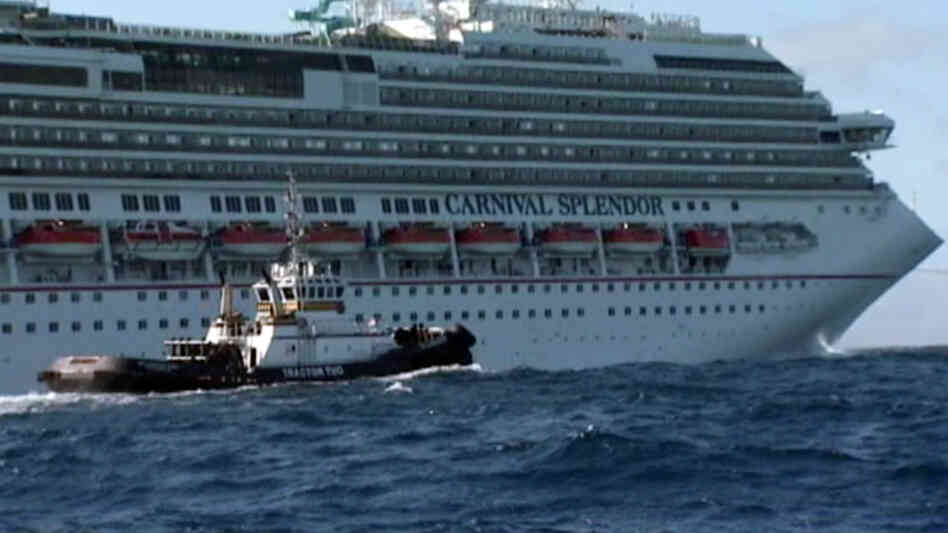 In this image taken from video, tugboats pull the disabled ship Carnival Splendor toward San Diego. In this image taken from video, tugboats pull the disabled ship Carnival Splendor toward San Diego.