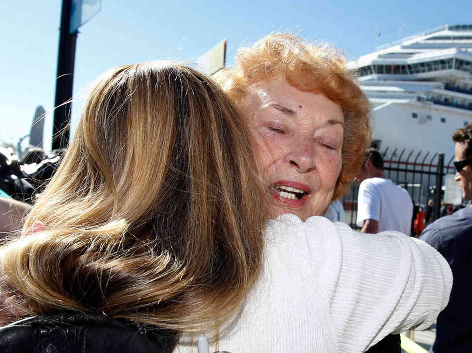Jeanne Ralston, facing camera, gets a hug from her daughter Cindi Wolfe after disembarking. Jeanne Ralston, facing camera, gets a hug from her daughter Cindi Wolfe after disembarking.