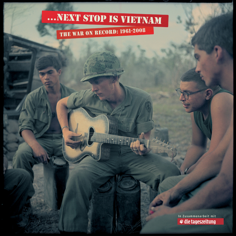 A soldier plays guitar in Vietnam.