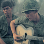 A soldier plays guitar in Vietnam. A soldier plays guitar in Vietnam.
