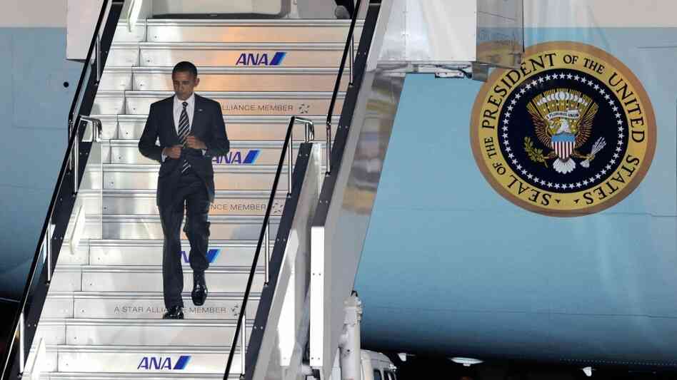 US President Barack Obama disembarks from the Air Force One upon his arrival in Tokyo, ahead of the US President Barack Obama disembarks from the Air Force One upon his arrival in Tokyo, ahead of the