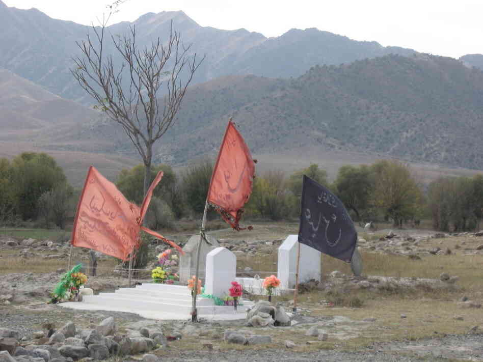 Red flags mark the graves of those Shiites who were killed in sectarian strife. Red flags mark the graves of those Shiites who were killed in sectarian strife.