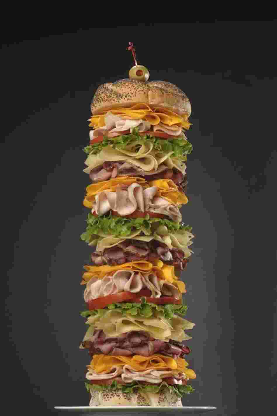 Building a tall sandwich involves some sleight-of-hand — and some hardware. The support system used to construct a 12-inch sandwich weighed almost 4 pounds. 
