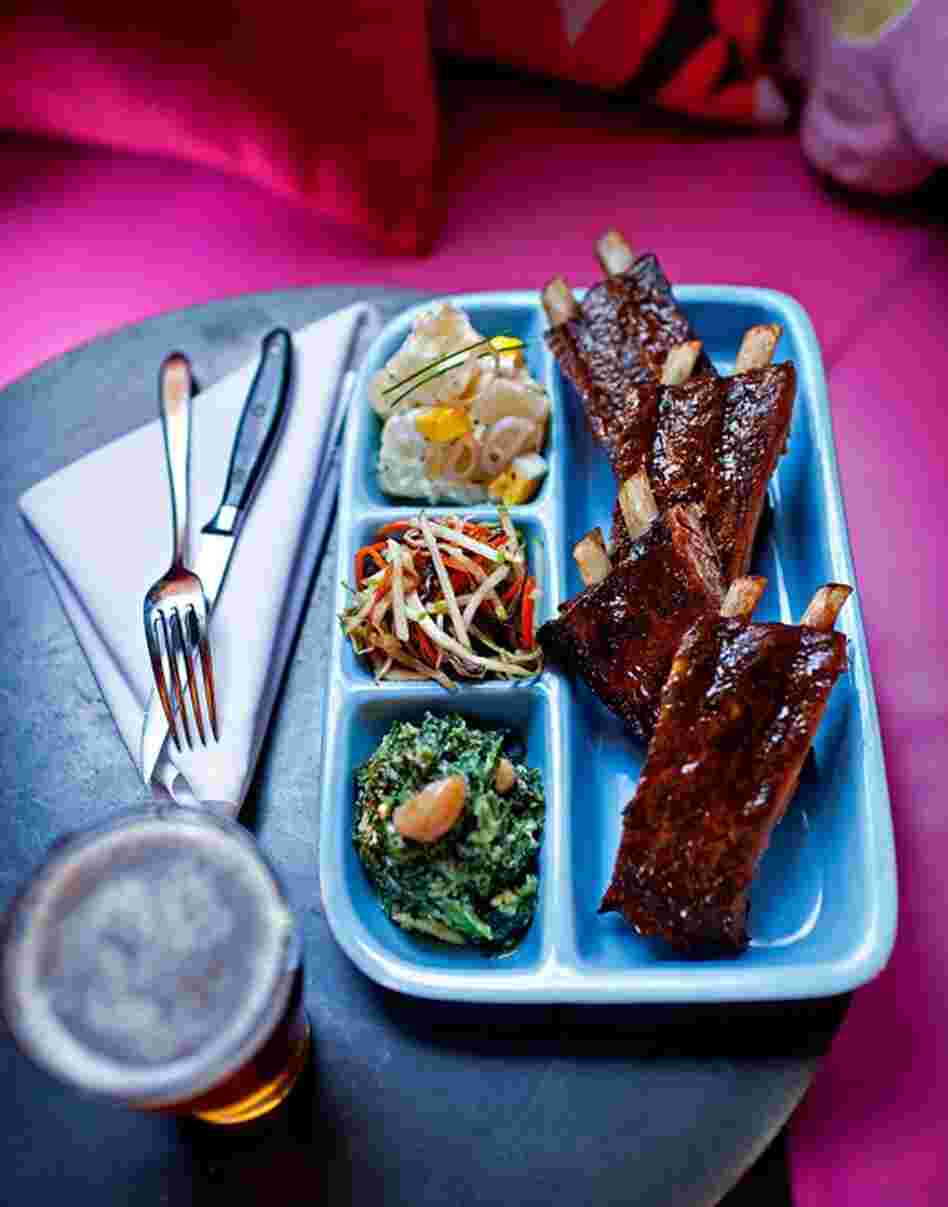 Barbecue ribs with potato salad, creamed spinach and cole slaw at  Jackie's Restaurant in Silver Spring, Maryland for The Washington Post Magazine 