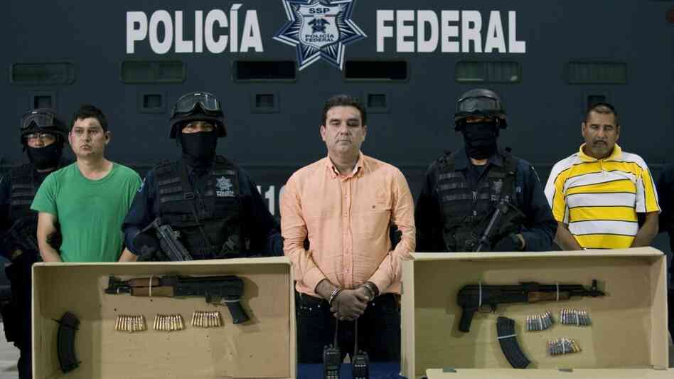 Alleged drug traffickers and the guns they were caught with Alleged drug traffickers and the guns they were caught with