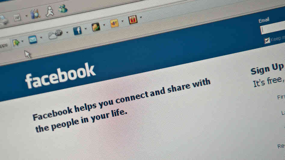 The Facebook homepage is seen on a compu The Facebook homepage is seen on a compu