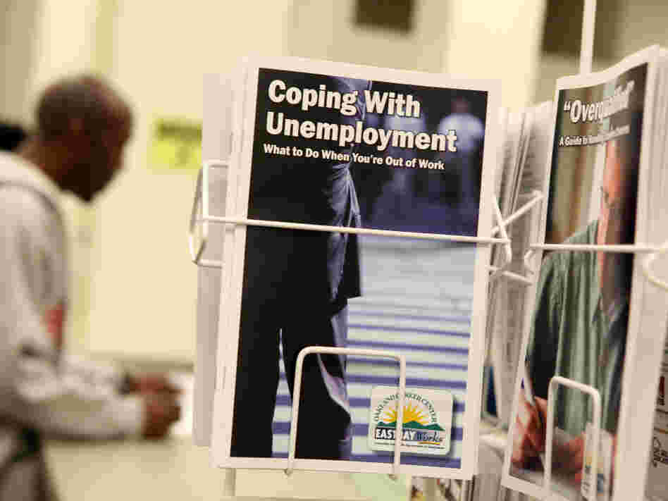 Pamphlets with information about unemployment are displayed in a career center in Oakland, Calif. Pamphlets with information about unemployment are displayed in a career center in Oakland, Calif.