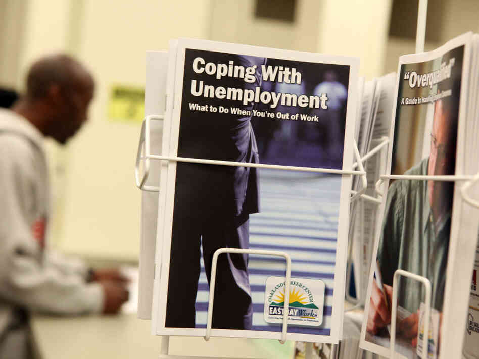 Pamphlets with information about unemployment are displayed in a career center in Oakland, Calif. Pamphlets with information about unemployment are displayed in a career center in Oakland, Calif.