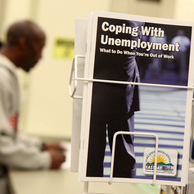  Pamphlets with information about unemployment are displayed in a career center in Oakland, Calif.