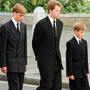 Prince Charles walks with his family outside Westminister Abbey after Princess Diana's funeral.